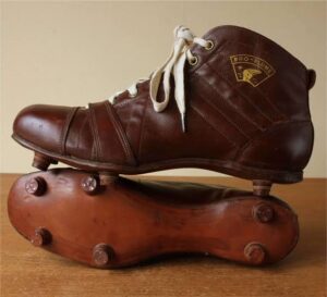 Vintage heavy leather football boots from the 1800s.